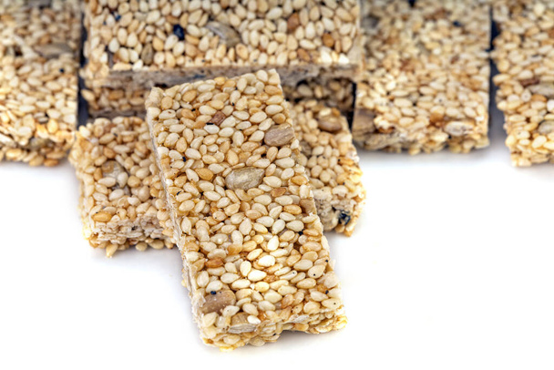 Sesame seeds Bars, Grain Bar, Nut Bars, Peanut Bars - sweet snacks, mixed and compressed grains, Peanut, White Sesame seeds, Black Sesame seeds, Pumpkin seeds, Sunflower seeds, Almond sliced seeds with sugar and salt, they are candy bars or other sug - Photo, Image