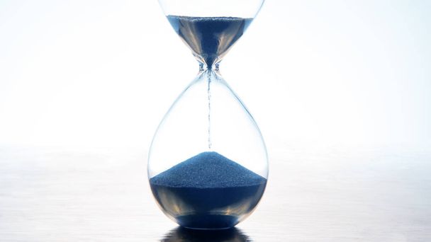 hourglass on a light background. time and minute measurement - Photo, Image