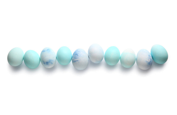 Row of painted Easter eggs on white background - Foto, afbeelding