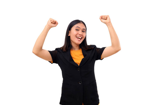 Захоплена молода азіатська бізнес-леді святкує свій успіх з піднятими руками. Ізольовані на білому
 - Фото, зображення