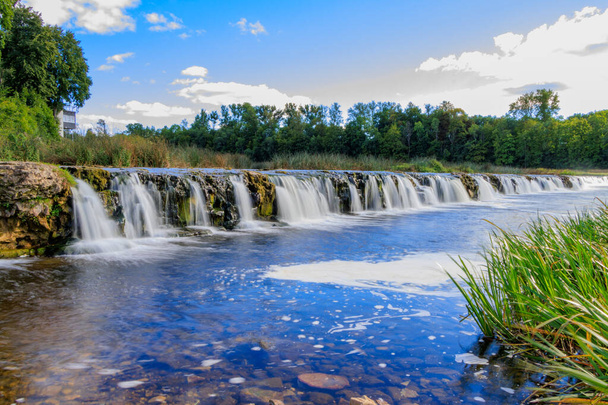 Kuldiga. Ventas-Rumba waterfall.The widest waterfall in Europe (249 m), of natural nature, a number of legends and historical events are associated with the waterfall. - 写真・画像