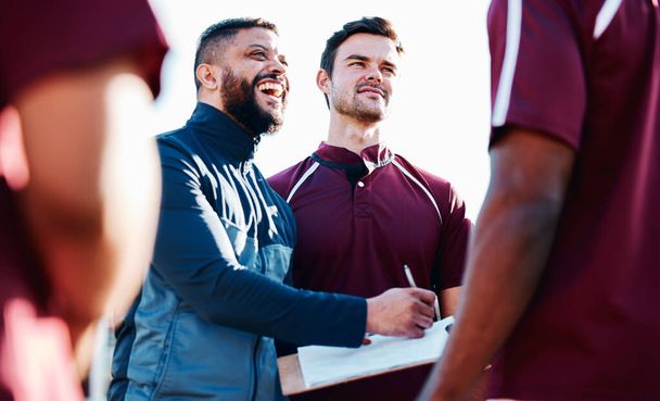 Coaching, rugby or happy man writing with a strategy, planning or training progress with a game formation. Leadership, mission or funny guy with sports men or athlete group for fitness or team goals. - Photo, image