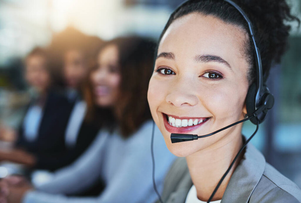 Dont delay, call us today. Portrait of a young woman working in a call centre - Foto, imagen