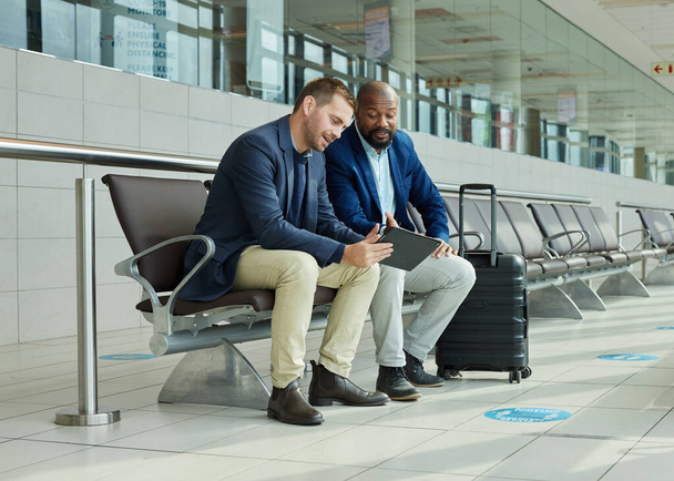 Airport partner, business tablet and people for online flight booking, travel news or digital schedule management app. Communication, lobby and tech of international black man with immigration advice. - Foto, Bild