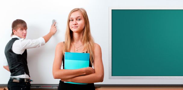 Two students - girl and boy making presentation at classroom - Fotoğraf, Görsel