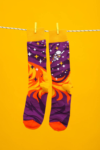 Concept of clothes for legs - socks, socks hanging on rope - Valokuva, kuva