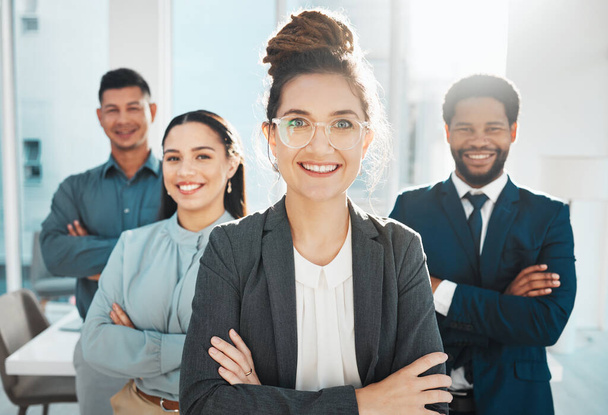 Portrait, collaboration and leadership with a manager woman and her team standing arms crossed in the office. Vision, teamwork or diversity and a female leader posing at work with her employee group. - Foto, Imagem