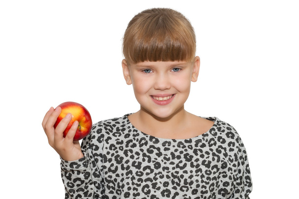 Portret ładny dziewczyna trzyma jabłko na białym tle - Zdjęcie, obraz