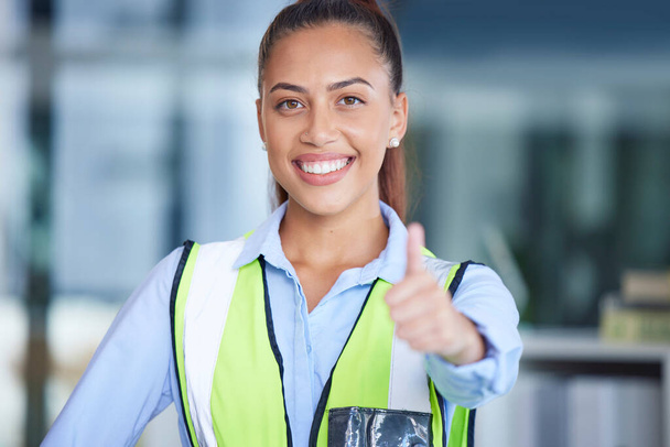 Engineer, portrait and woman with thumbs up in office for project management and success. Architect, construction or safety worker with hand sign or like emoji for support, thank you or motivation. - Photo, image
