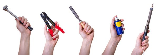 Hands holding hand tools, insulated on white background. Tool soldering iron, paint can and crimping tool. - Photo, Image
