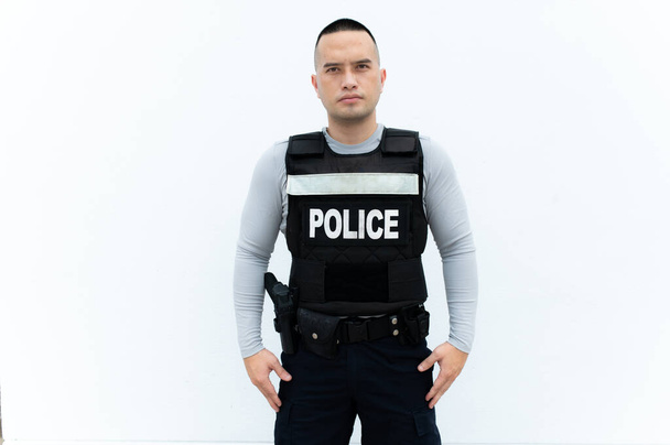Portrait of police hold gun in hand on white background,Handsome asian cop - Photo, Image