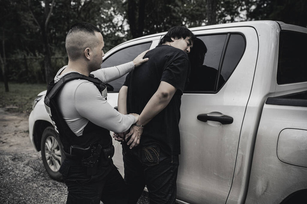 Police and thief concept,The cop catch criminals break the law - Fotografie, Obrázek