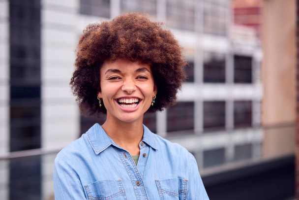 Portrait Of Smiling Young Businesswoman Standing Outside Modern Office - Φωτογραφία, εικόνα