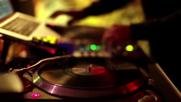 A cool dj behind the turntables performing in a bar - Footage, Video