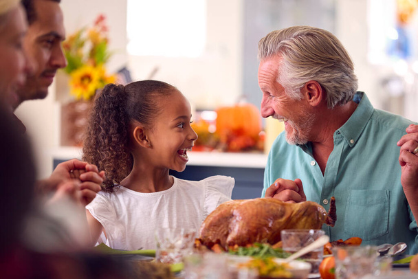 Multi-Generation Family Celebrating Thanksgiving At Home Eating Meal Together - Valokuva, kuva