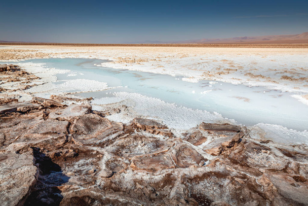 Salt lake reflection and idyllic volcanic landscape at sunrise, Atacama desert, Chile border with Bolivia - Photo, Image