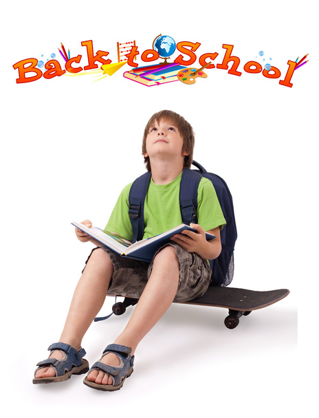 Kid on skateboard with back to school theme isolated on white - 写真・画像