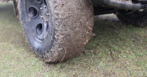 Closeup of wheel in countryside with dirt road. Off-road racing 4x4 - Filmati, video