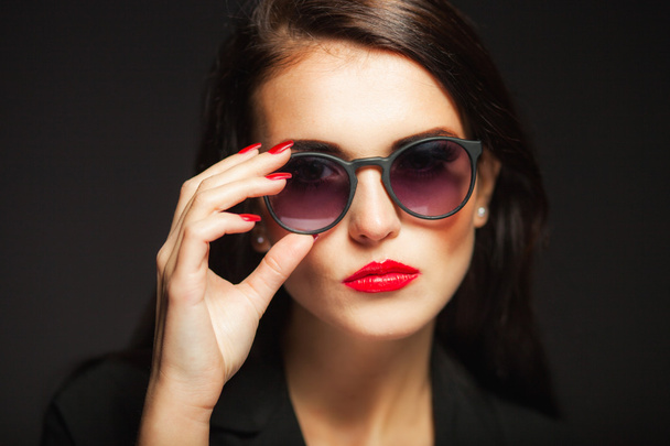 Glamour woman with sunglasses, red lips and nails - 写真・画像