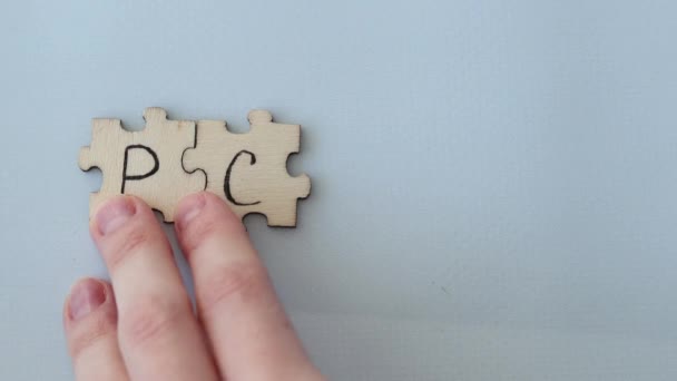 Polycystic Ovarian Syndrome. Hand Writing PCOS on wooden puzzles - Metraje, vídeo