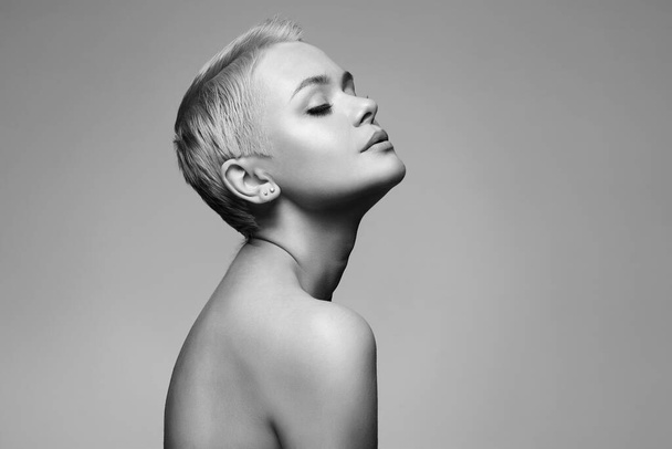 Short Hair Beautiful young woman. sensual girl with blond Hair. Bald Hair style - Photo, Image