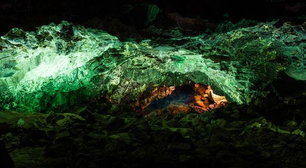 Panoramic view of green cave lava tube illuminated in Canary Islands. Geological cavern formation, tourist attraction concepts - 写真・画像