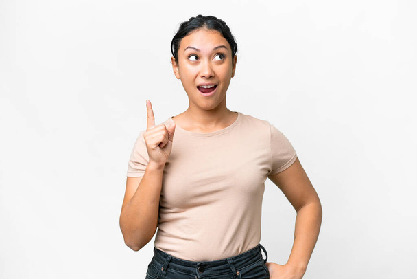 Young Uruguayan woman over isolated white background intending to realizes the solution while lifting a finger up - Фото, зображення