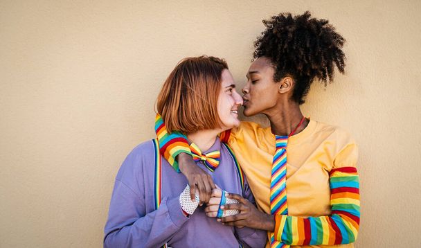 Multiracial lesbian couple celebrating gay pride day - Lgbt and love relationship concept - Foto, immagini