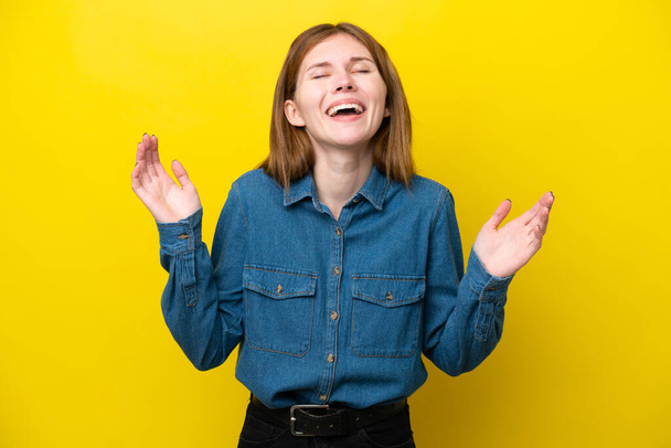 Young English woman isolated on yellow background smiling a lot - Foto, Imagem