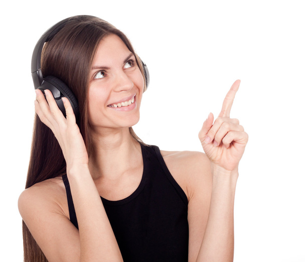A woman with headphones listening to music and finger up - Photo, Image