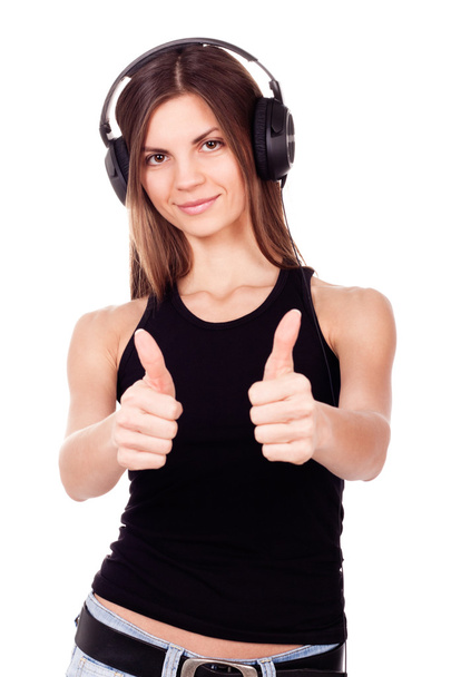 Beautiful woman listen to the music in her headphones - Foto, afbeelding
