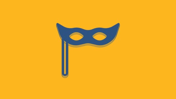 Blue Festive mask icon isolated on orange background. Merry Christmas and Happy New Year. 4K Video motion graphic animation . - Séquence, vidéo