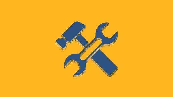 Blue Crossed hammer and wrench spanner icon isolated on orange background. Hardware tools. 4K Video motion graphic animation . - Filmati, video