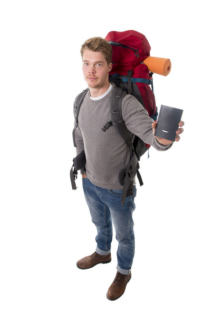 young backpacker tourist holding passport carrying backpack ready for travel - Foto, Imagem