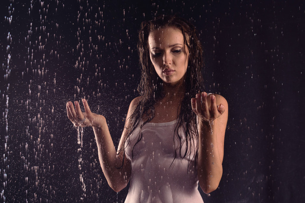 Sexy woman in white shirt posing under water - Fotó, kép