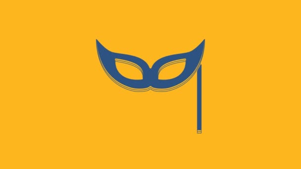 Blue Festive mask icon isolated on orange background. Merry Christmas and Happy New Year. 4K Video motion graphic animation . - Séquence, vidéo