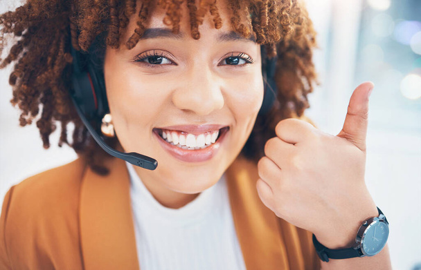 Black woman, portrait and thumbs up in call center for customer service, support or crm in office. Happy person consultant, receptionist or agent smile for telemarketing or contact us hand like emoji. - Foto, Bild