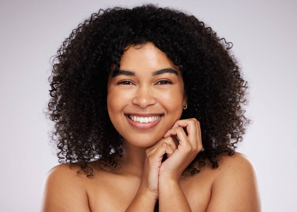 Portrait, beauty and hair with a model black woman in studio on a gray background for natural afro treatment. Face, skincare and haircare with an attractive young female posing to promote cosmetics. - Foto, afbeelding
