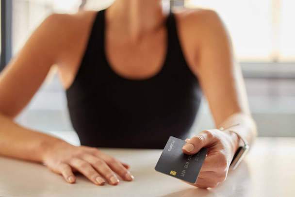 Hands, credit card and payment at gym for fitness membership or exercise subscription. Fintech, ecommerce and athlete or woman buying or paying for workout or training at exercising club for health - Valokuva, kuva