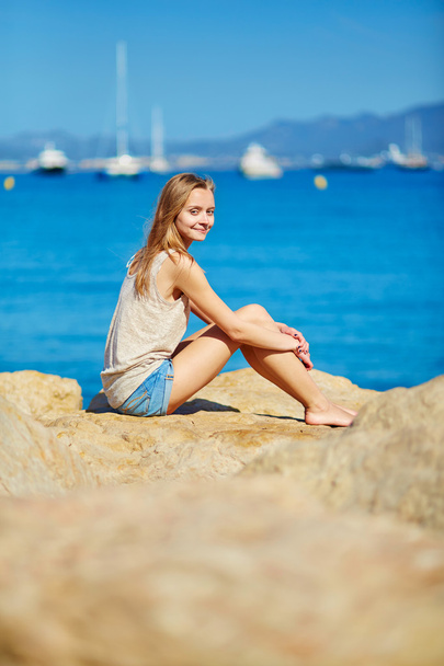 Beautiful girl enjoying her vacation by the sea  - Φωτογραφία, εικόνα