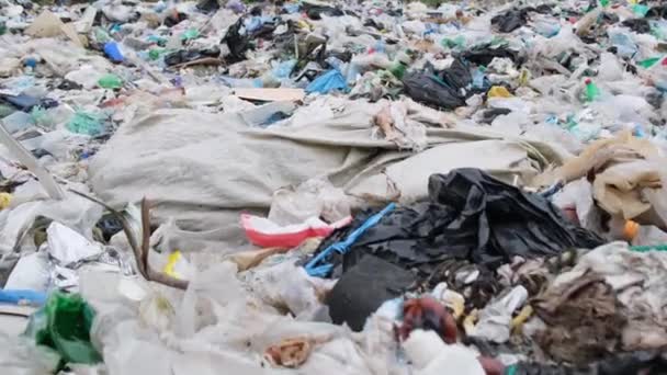 Contaminated ocean beaches with plastic debris. Plastic waste, environmental pollution. Environmental disaster - Záběry, video