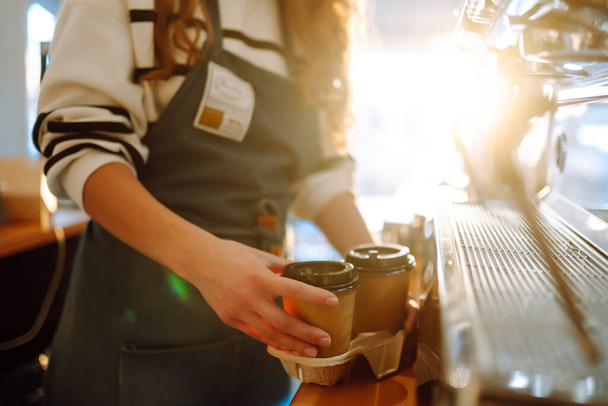 Young  barista girl with coffee. Small business owner, food and drink industry concept - Foto, immagini