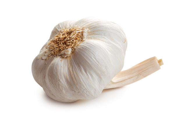 Garlic. A head of ripe garlic on a white background. Isolate - Foto, Bild