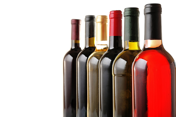 Wine bottles in row isolated on white - Foto, Imagem