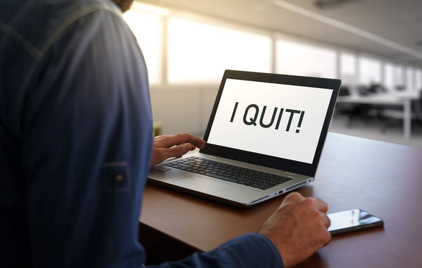Worker in an office with the message I quit on screen. Business Quiet quitting concept or burnout - Foto, Imagem