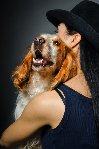 Russian Spaniel in the embrace of a young woman - Fotografie, Obrázek