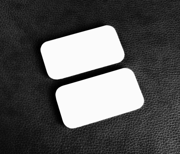 Blank business cards with rounded corners on a black leather bac - Zdjęcie, obraz