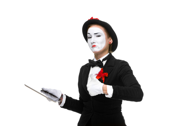 business woman in the image mime holding tablet PC - Foto, Imagen