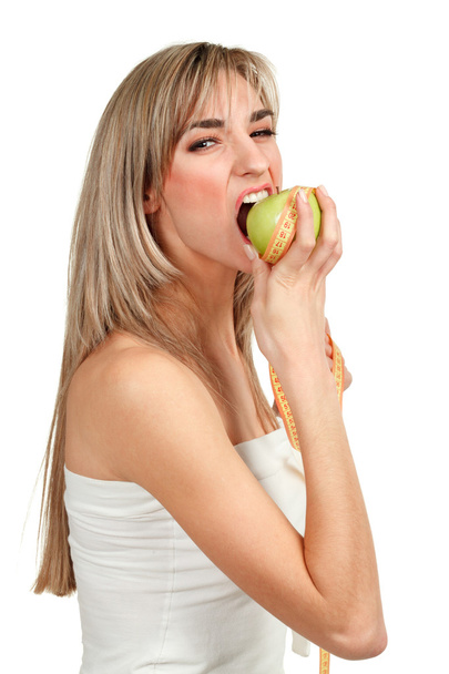 Woman holding an apple on a white background - Photo, Image