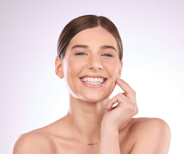 Beauty, woman and portrait in studio for skincare, dermatology and wellness cosmetics on background. Happy female model, smile and aesthetic glow of shine, laser transformation and facial spa results. - Photo, Image